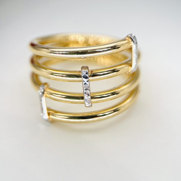 ANILLO DE ORO AMARILLO Y BLANCO DE 18 KILATES CON CIRCONITAS